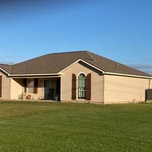 Southern Louisiana home with new roof and column wraps