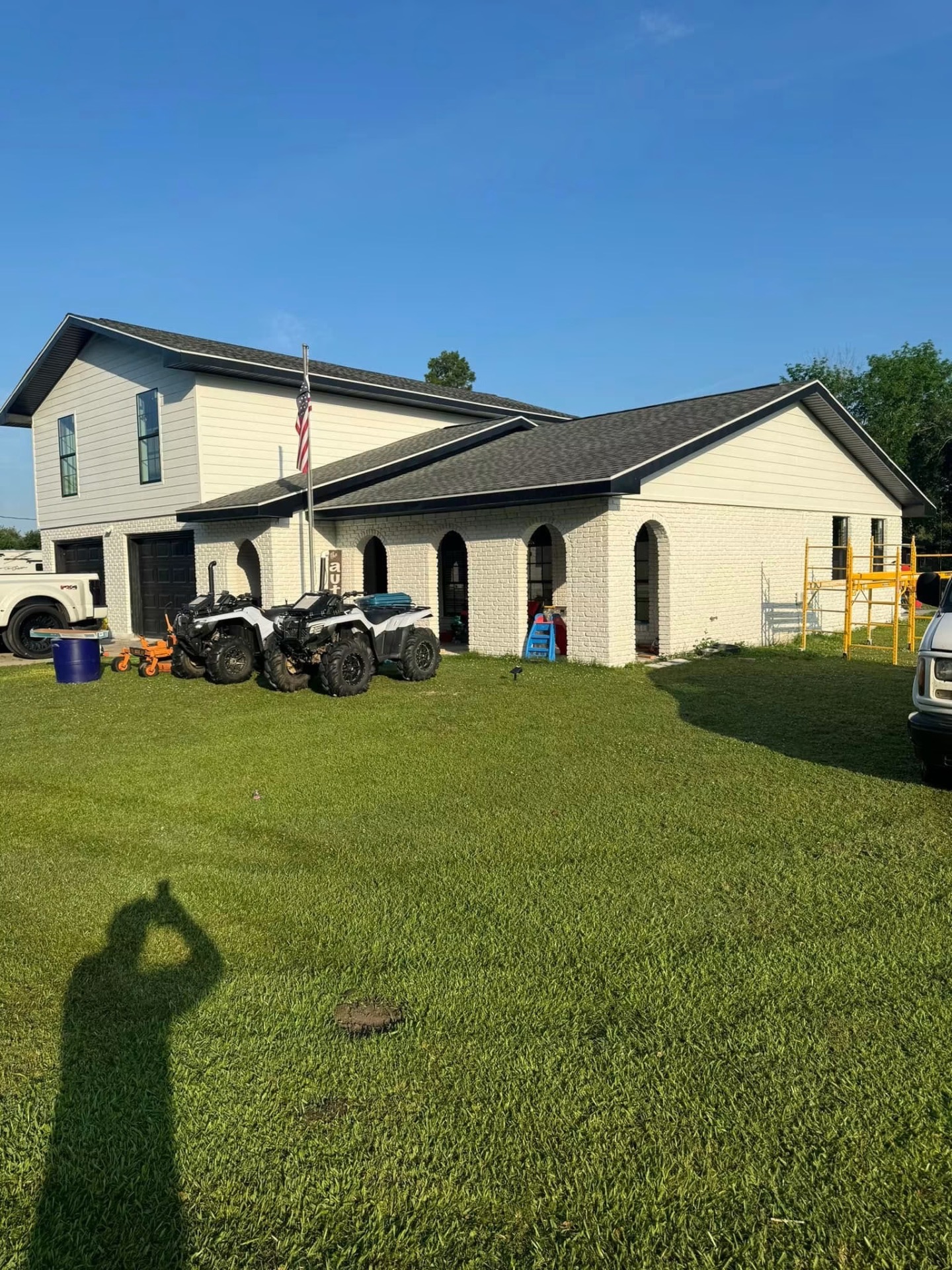 Luxury South Louisiana home with new architectural shingle roof at dusk